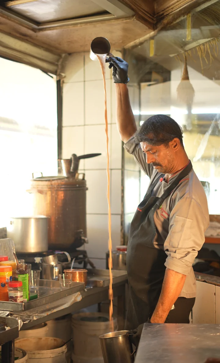 Chai pulled high into a steel cup at Aaraamam Karama